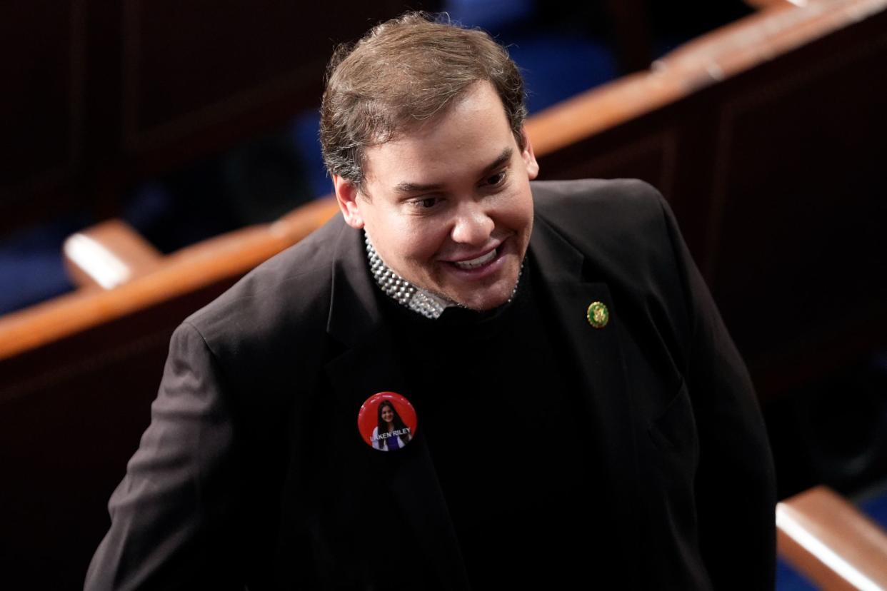 Former Rep. George Santos, R-N.Y., wears a Laken Riley button before President Joe Biden delivers the State of the Union address to a joint session of Congress at the U.S. Capitol, Thursday March 7, 2024, in Washington. (AP Photo/Andrew Harnik)