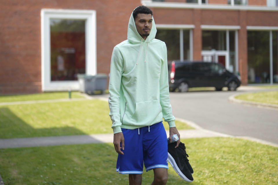 France's basketball player Victor Wembanyama, who plays for the NBA San Antonio Spurs, arrives for media day at the French National Institute of Sport and Physical Education, in Vincennes, outside Paris, Thursday, June 27, 2024. (AP Photo/Thibault Camus)