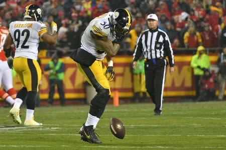 Jan 15, 2017; Kansas City, MO, USA; Pittsburgh Steelers inside linebacker Ryan Shazier (50) spins the ball during the second quarter against the Kansas City Chiefs in the AFC Divisional playoff game at Arrowhead Stadium. Mandatory Credit: Denny Medley-USA TODAY Sports