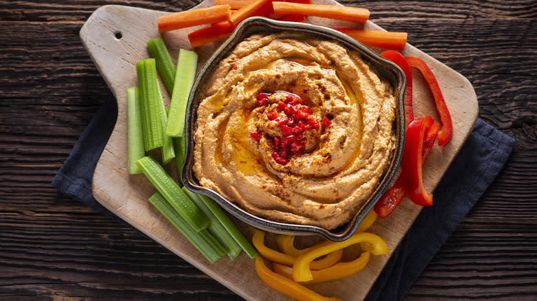 A tray of hummus and vegetables