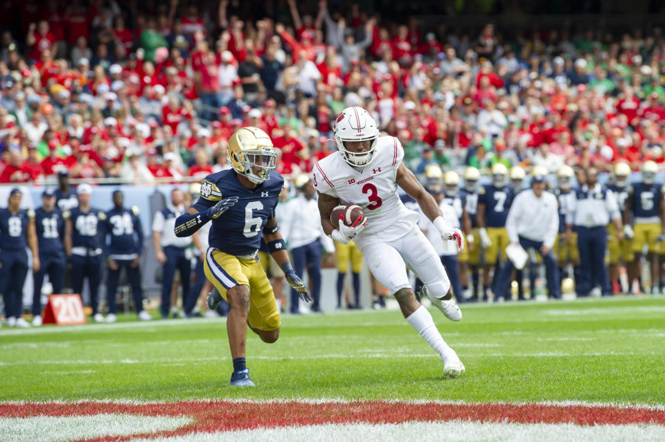 Sept. 25, 2021; Chicago, Illinois; Wisconsin Badgers wide receiver Kendric Pryor (3) runs in for a touchdown against Notre Dame Fighting Irish cornerback Clarence Lewis (6) during the second half at Soldier Field. Patrick Gorski-USA TODAY Sports