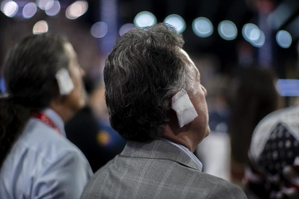 a photograph of ear bandages worn by attendees at the Republican National Convention to express sympathy with Donald Trump