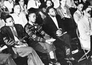 <p>Martin Luther King, Jr., third from left, listens to a speaker during an assembly at Morehouse College in Atlanta. As a teenager in 1944, King worked on a tobacco farm in Connecticut. That experience influenced his decision to become a minister. (AP Photo) </p>