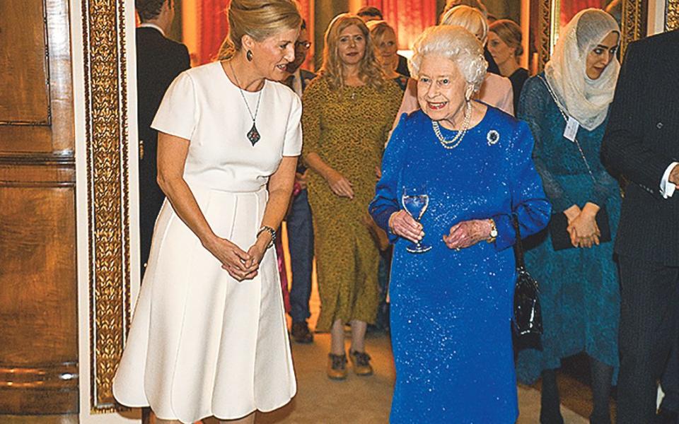 With the Queen at Buckingham Palace in 2019 - Getty Images