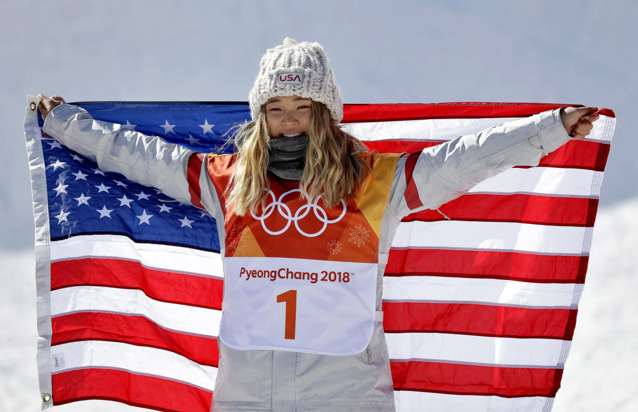 ChloeKim, of the United States, celebrates winning gold in the women’s halfpipe finals at Phoenix Snow Park at the 2018 Winter Olympics in Pyeongchang, South Korea, Tuesday, Feb. 13, 2018. (AP Photo/Gregory Bull)