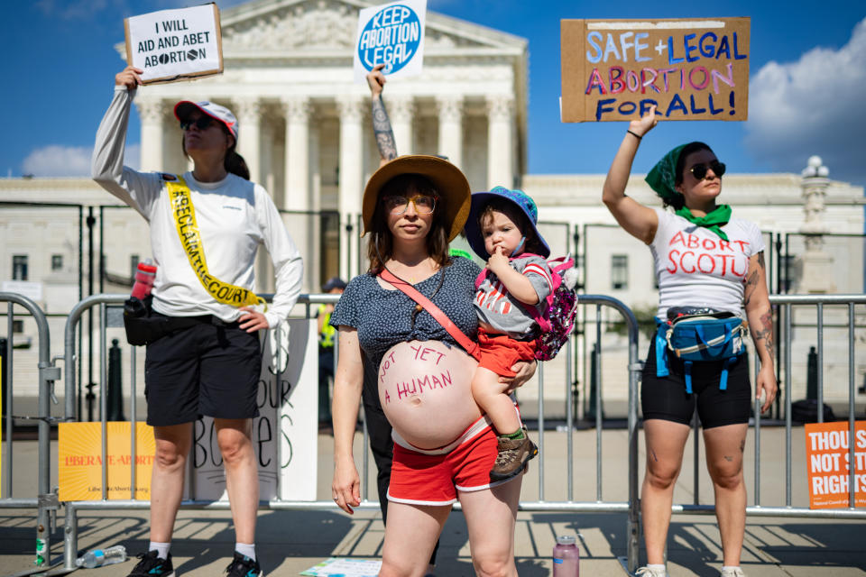 Image: Abortion rights demonstrator Amanda Herring and her 1-year-old son Abraham outside the Supreme Court on June 24, 2022. (Hannah Beier for NBC News)