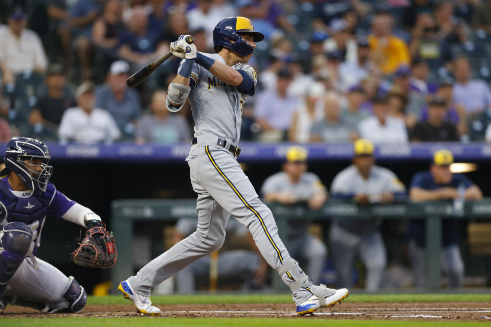 DENVER, CO - SEPTEMBER 6:  Christian Yelich #22 of the Milwaukee Brewers hits a single in the third inning against the Colorado Rockies at Coors Field on September 6, 2022 in Denver, Colorado. (Photo by Justin Edmonds/Getty Images)