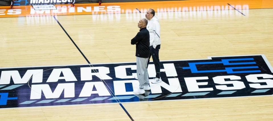 Acting Kansas head coach Norm Roberts and assistant coach Kurtis Townsend watch their players during a team shoot around a day ahead of Kansas’ first round game against Howard in the NCAA college basketball tournament Wednesday, March 15, 2023, in Des Moines, Iowa.