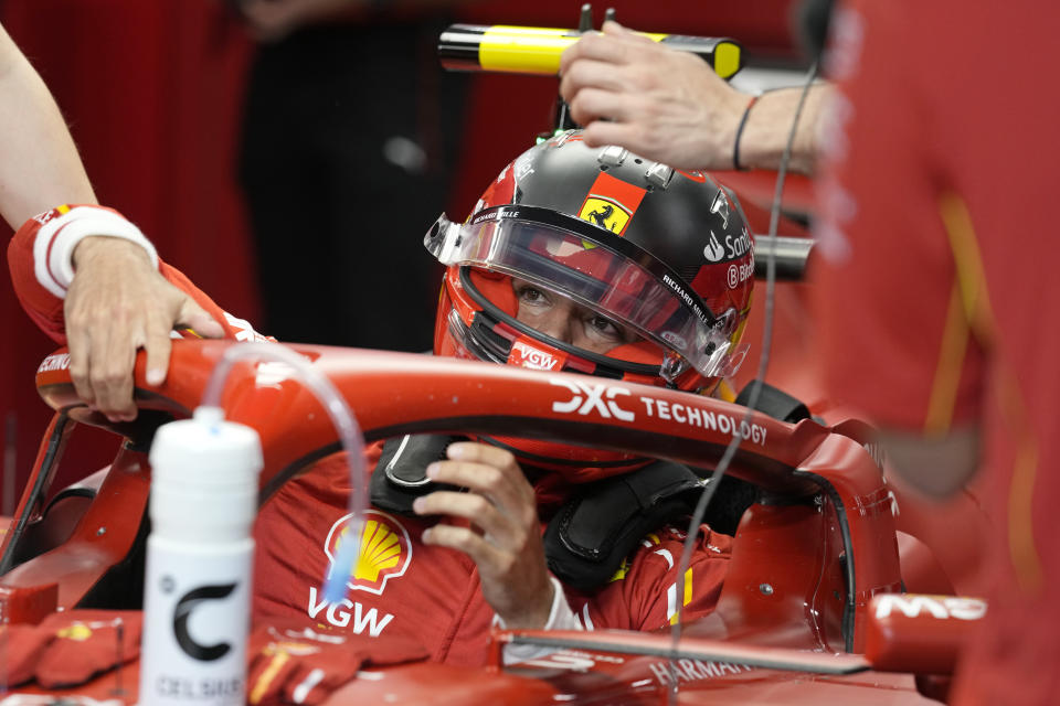 Ferrari driver Carlos Sainz of Spain sits in his car before the start of the second practice session ahead of the Formula One Saudi Arabian Grand Prix at the Jeddah Corniche Circuit in Jeddah, Saudi Arabia, Thursday, March 7, 2024. The Saudi Arabian Grand Prix will be held on Saturday, March 9, 2024. (AP Photo/Darko Bandic)