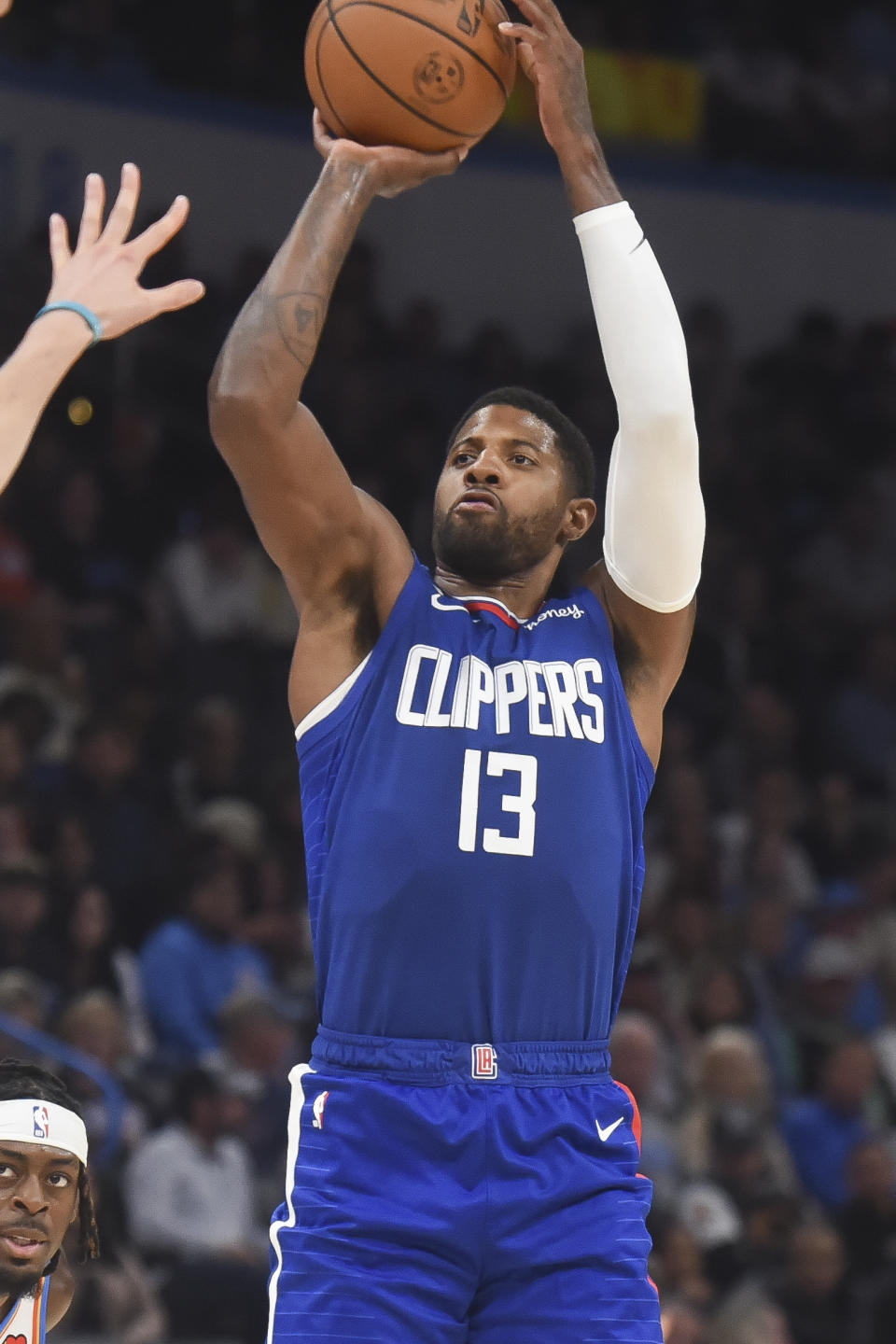 Los Angeles Clippers forward Paul George shoots in the second half of an NBA basketball game against the Oklahoma City Thunder, Thursday, Oct. 27, 2022, in Oklahoma City. (AP Photo/Kyle Phillips)