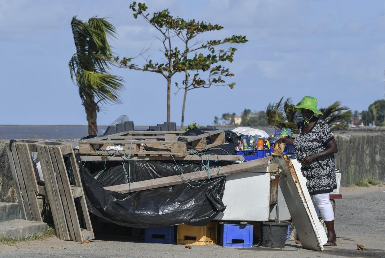 <span class="caption">A woman sells drinks on a street in Georgetown in Guyana, one of South America's poorest countries, March 1, 2020. </span> <span class="attribution"><a class="link " href="https://www.gettyimages.com/detail/news-photo/woman-sells-water-and-soda-in-a-street-stall-in-georgetown-news-photo/1204536568" rel="nofollow noopener" target="_blank" data-ylk="slk:Luis Acosta/AFP via Getty Images;elm:context_link;itc:0;sec:content-canvas">Luis Acosta/AFP via Getty Images</a></span>