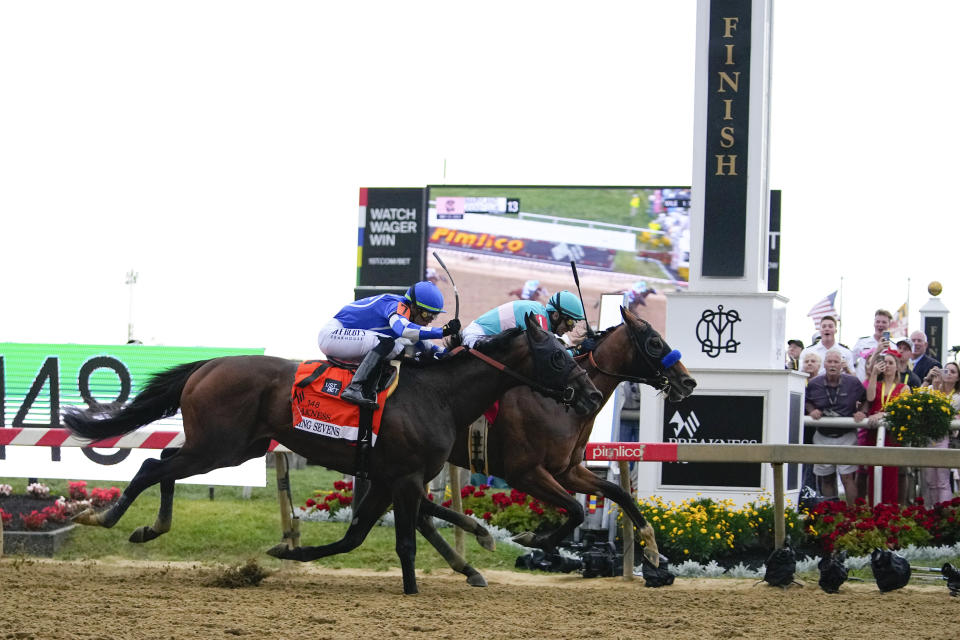 National Treasure, right, with jockey John Velazquez, edges out Blazing Sevens, with jockey Irad Ortiz Jr., to win the148th running of the Preakness Stakes horse race at Pimlico Race Course, Saturday, May 20, 2023, in Baltimore. (AP Photo/Julio Cortez)