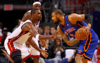 MIAMI, FL - APRIL 30: Tyson Chandler #6 of the New York Knicks posts up Chris Bosh #1 of the Miami Heat during Game Two of the Eastern Conference Quarterfinals in the 2012 NBA Playoffs at American Airlines Arena on April 30, 2012 in Miami, Florida. NOTE TO USER: User expressly acknowledges and agrees that, by downloading and/or using this Photograph, User is consenting to the terms and conditions of the Getty Images License Agreement. (Photo by Mike Ehrmann/Getty Images)