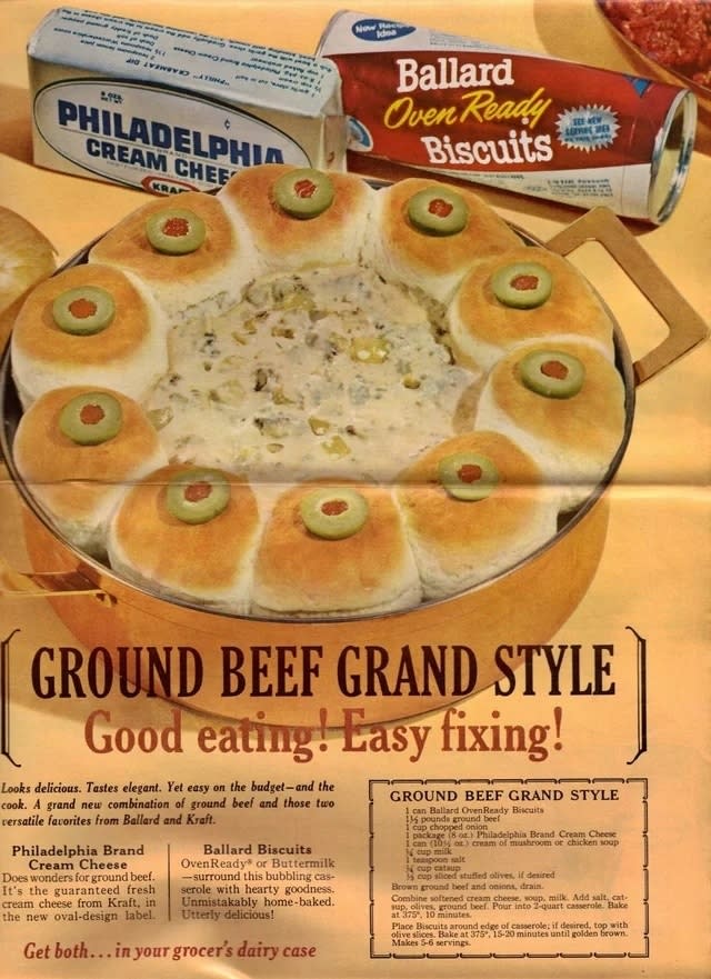 a recipe card for ground beef grand style with an image of a tin lined with biscuits and filled with a ground beef mixture in the center