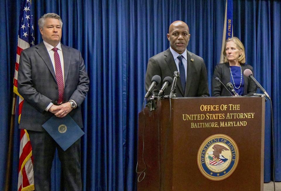 Erek L. Barron, U.S. Attorney for Maryland, speaks during a news conference in Baltimore, Monday, Feb. 6, 2023. Barron announced the arrests and a federal criminal complaint charging Sarah Beth Clendaniel, of Catonsville, and Brandon Clint Russell, of Orlando, with conspiracy to destroy an energy facility. At left is FBI Special Agent in Charge Thomas J. Sobocinski, and at right is Assistant U.S. Attorney Kathleen O. Gavin. (Amy Davis/The Baltimore Sun via AP)