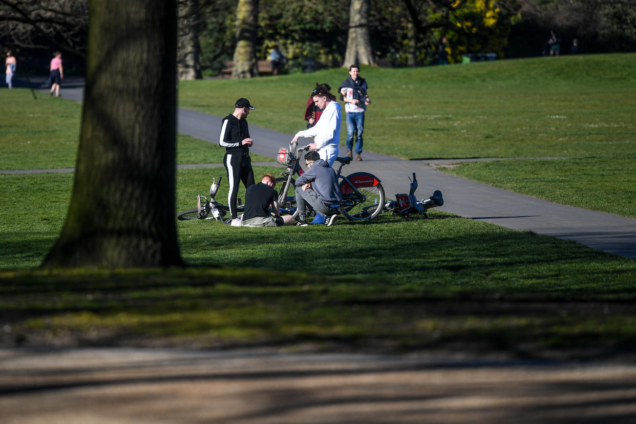 LONDON, ENGLAND  - APRIL 05: A group of young men are seen gathered in Greenwich Park on April 5, 2020 in London, England . The Coronavirus (COVID-19) pandemic has spread to many countries across the world, claiming over 60,000 lives and infecting over 1 million people. (Photo by Peter Summers/Getty Images)