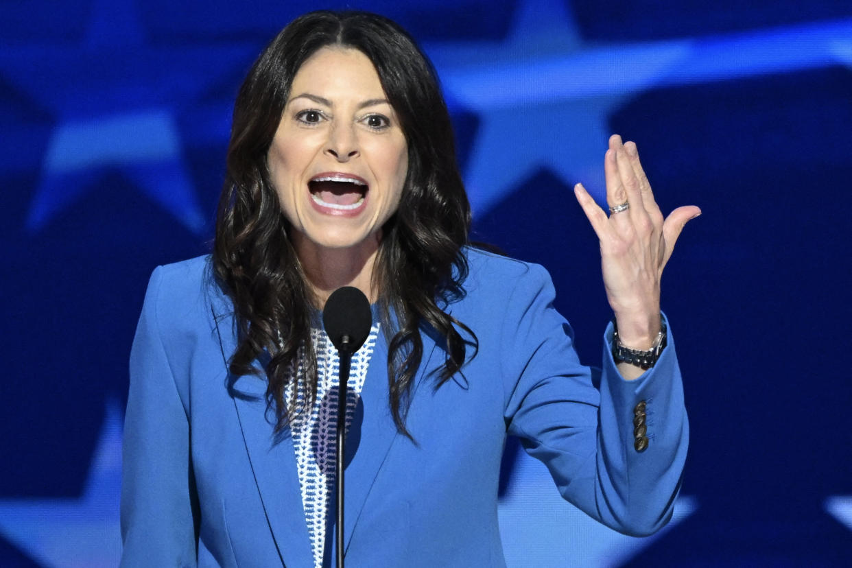 Michigan Attorney General Dana Nessel shows her wedding band.