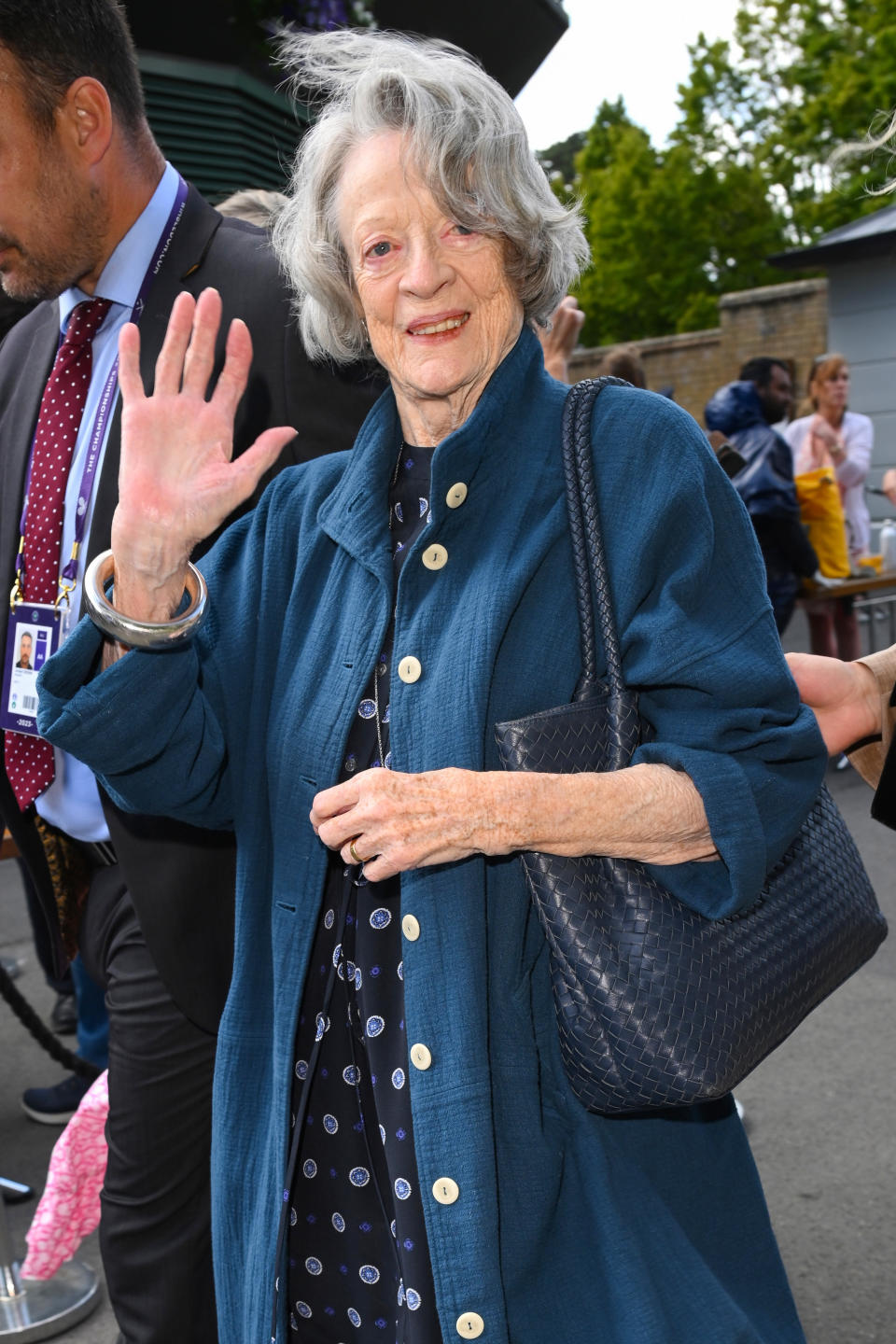 closeup of her waving to fans