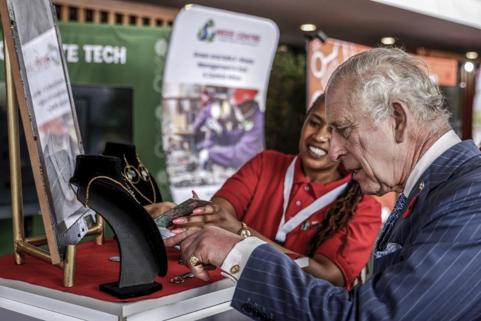 Britain's King Charles III interacts with an entrepreneur during a visit to a Tech and Innovation showcase at Nairobi Garage in Nairobi, Kenya, Tuesday. Oct. 31, 2023. King Charles is in Kenya for a four-day trip, his first state visit to a Commonwealth country as monarch, underscoring his commitment to an organization that's been central to Britain's global power and prestige since World War II. (Luis Tato, Pool via AP)