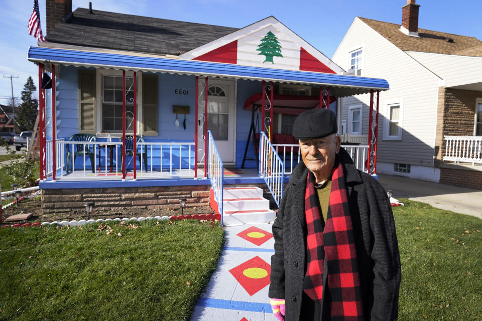 Samih Zreik stands in front of his house, Thursday, Nov. 19, 2020, in Dearborn, Mich. Zreik painted his house in tribute to Lebanon following the blast at Beirut's port that killed nearly 200 people, wounded more than 6,000 and caused billions of dollars in damage. (AP Photo/Carlos Osorio)