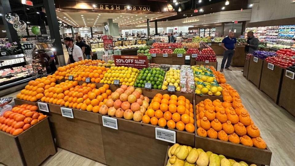 A crowd of several hundred early Wednesday morning, 4/24/2024, gathered for the opening of The Fresh Market at The Green shopping center, 11525 S.R. 70 E. , Lakewood Ranch. Store associates make last minute checks before the doors opened.