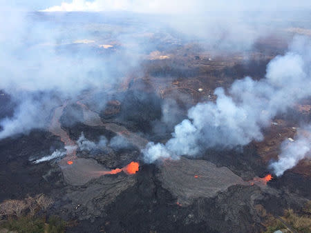 Fissures 6 and 13 show lava flows merging into one channel that flows into the ocean at the western-most entry, in Hawaii, U.S. May 25, 2018. USGS/Handout via REUTERS