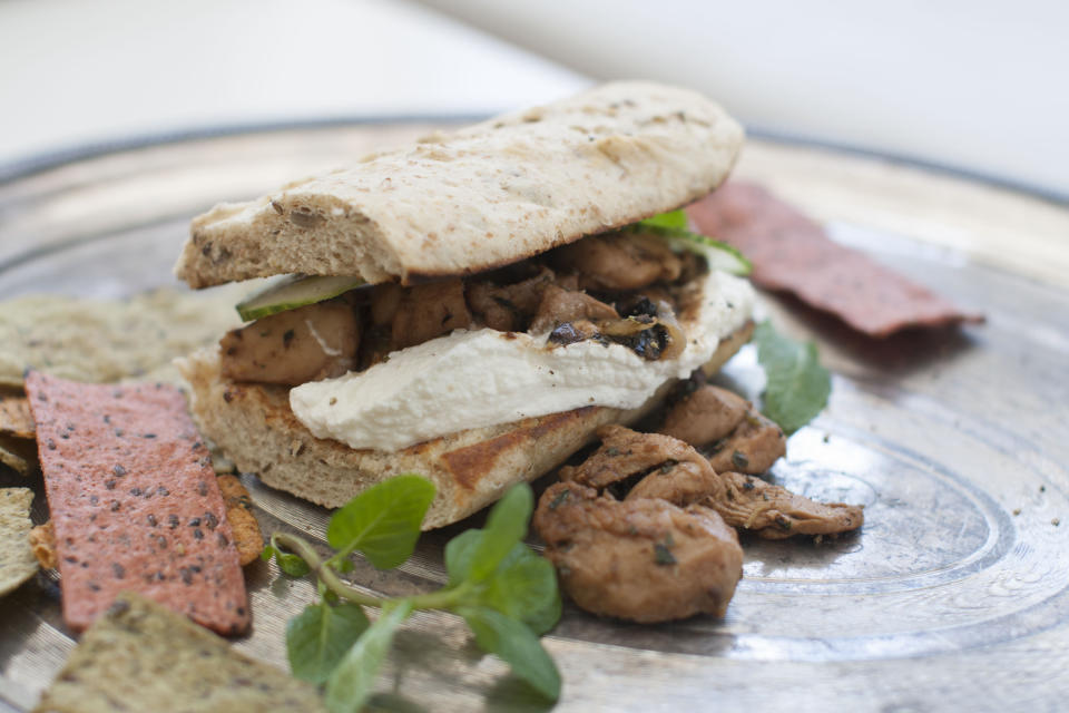 This March 24, 2014 photo shows minted lemon and olive chicken wraps in Concord, N.H. (AP Photo/Matthew Mead)