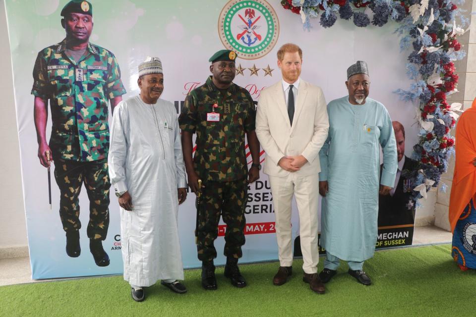 abuja, nigeria may 11 britains prince harry 2nd r, duke of sussex poses for a photo with nigerias chief of general staff general christopher gwabin musa 2th l and other participants as he attends the program held in the armed forces complex in abuja, nigeria on may 11, 2024 photo by emmanuel osodianadolu via getty images