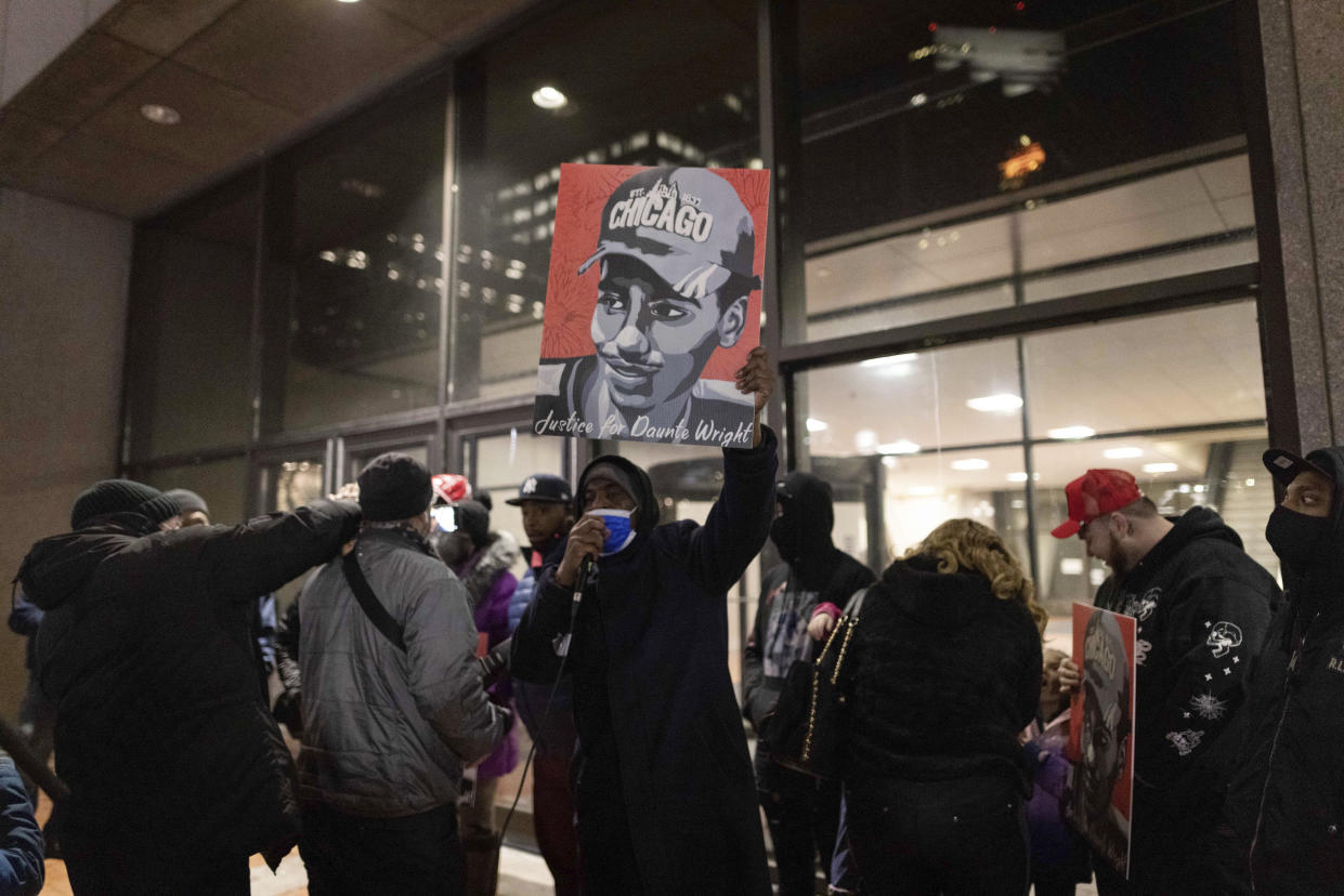 Protesters gather alongside the family of Daunte Wright outside of the Hennepin County Government Center on Wednesday, Dec. 22, 2021, in Minneapolis. Former Minneapolis police officer Kim Potter, who is white, is charged with first- and second-degree manslaughter in the shooting of Wright, a Black motorist, in the suburb of Brooklyn Center. Potter has said she meant to use her Taser – but grabbed her handgun instead – after Wright tried to drive away as officers were trying to arrest him. (AP Photo/Christian Monterrosa)