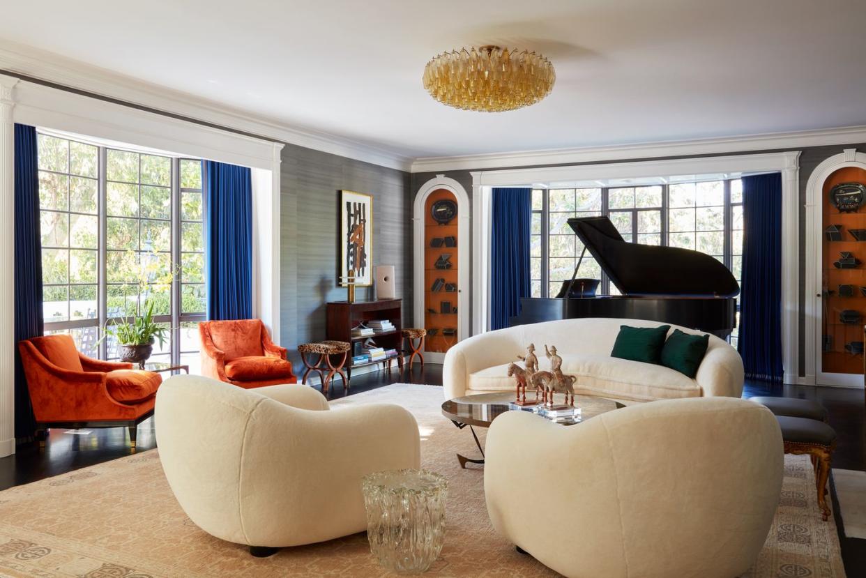 a living room with a chandelier and a couch