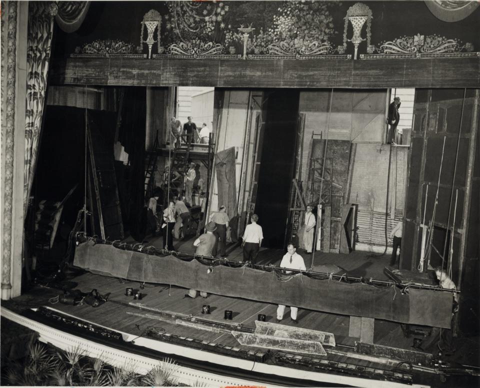 Stagehands set up scenery in 1942 at the Colonial Theatre in downtown Akron.