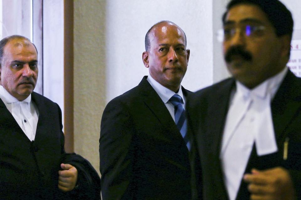 Former Asian International Centre for Arbitration’s (AIAC) director Datuk Sundra Rajoo Nadarajah (centre) leaves the Sessions Court in Kuala Lumpur March 26, 2019. — Picture by Hari Anggara