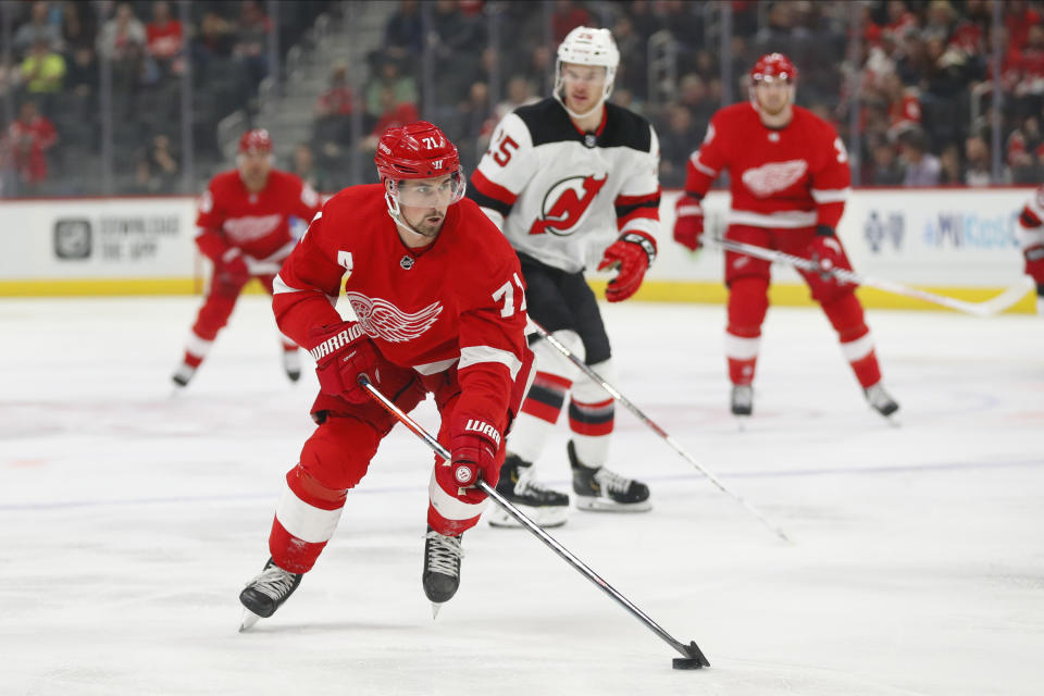 FILE - In this Feb. 25, 2020, file photo, Detroit Red Wings center Dylan Larkin (71) skates with the puck against the New Jersey Devils in the first period of an NHL hockey game in Detroit. The Red Wings are entering the fifth season of a rebuilding project and this still might not be the year that they break through and make the playoffs. (AP Photo/Paul Sancya, File)