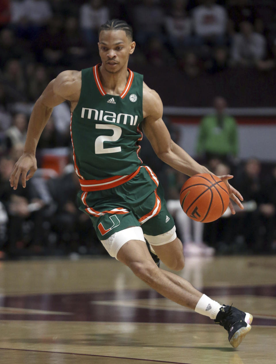 Miami's Isaiah Wong (2) drives during the first half of the team's NCAA college basketball game against Virginia Tech on Tuesday, Feb. 21, 2023, in Blacksburg, Va. (Matt Gentry/The Roanoke Times via AP)