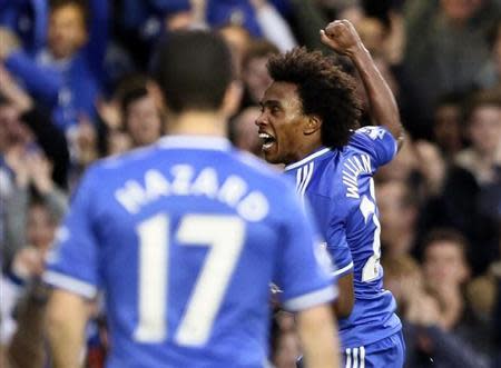 Chelsea's Willian (R) celebrates scoring a goal against Stoke City during their English Premier League soccer match at Stamford Bridge in London April 5, 2014. REUTERS/Paul Hackett