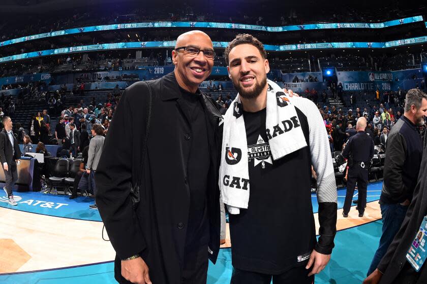 Mychal Thompson, left, and son Klay Thompson pose at the 2019 NBA All-Star Game