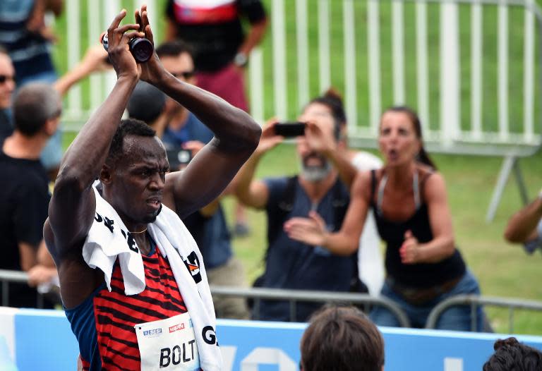 Jamaican sprinter and Olympic multi-champion Usain Bolt celebrates his victory in the exhibition race at Jockey Club in Rio de Janeiro, Brazil, on April 19, 2015