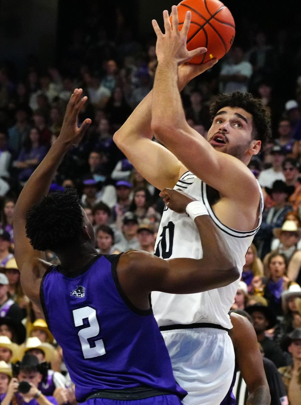 Jan 13, 2022; Phoenix, AZ, United States; GCU's Gabe McGlothan (30) shoots over Abilene Christian's Ja'Sean Jackson (2) during a game at GCU Arena. Mandatory Credit: Patrick Breen- The Republic