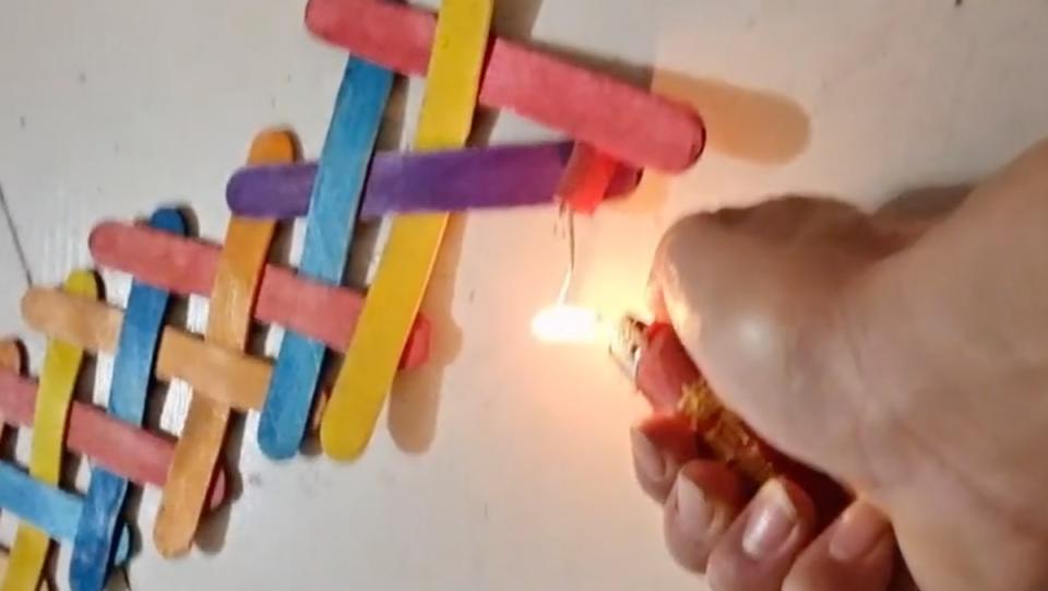 TikToker blwz2e lighting a chain reaction of weaved sticks with a tiny firework. 