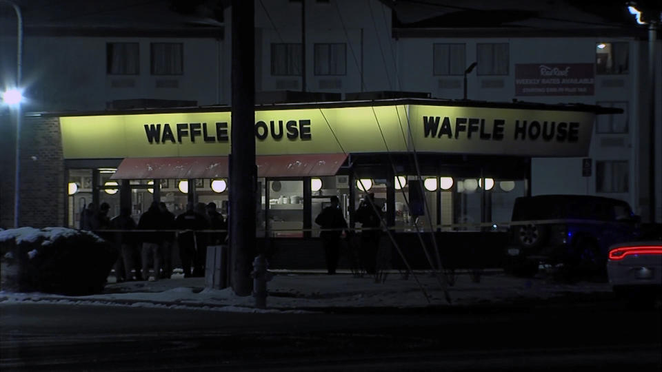 This screen shot from video provided by WRTV shows law enforcement outside of a Waffle House restaurant in Indianapolis early Monday, Feb. 19, 2024, where at least one person was killed and several injured. (WRTV via AP)