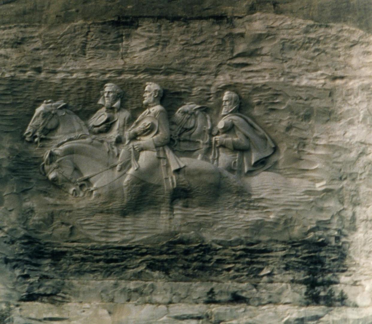 Confederate leaders Robert E Lee, Stonewall Jackson and Jefferson Davis are depicted in this carving on Stone Mountain, Ga. <a href="https://www.gettyimages.com/detail/news-photo/the-confederate-generals-carved-into-stone-mountain-in-news-photo/3094974?adppopup=true" rel="nofollow noopener" target="_blank" data-ylk="slk:MPI/Getty Images;elm:context_link;itc:0;sec:content-canvas" class="link ">MPI/Getty Images</a>