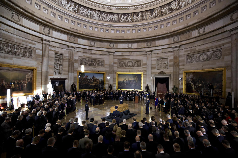 <p>The casket of the late Reverend Billy Graham, center, lies in honor during a service at the U.S. Capitol Rotunda in Washington on Wednesday, Feb. 28, 2018. (Photo: Andrew Harrer/Bloomberg via Getty Images) </p>