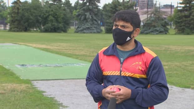 Ajax resident Ajit Parab has tried to secure a permit to play on Ajax's cricket pitch for four years. He's hoping the newly renovated facility will be open to everyone and won't just be for the use of the Ajax Cricket Club. (CBC - image credit)