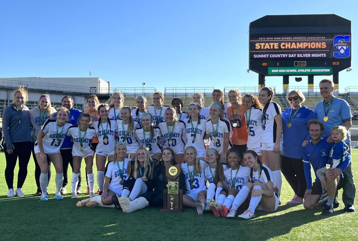 Summit senior Maggie McDowell holds the state championship trophy with the team as Summit Country Day defeated Rocky River 1-0 in the OHSAA Division II girls soccer state championship game Nov. 10, 2023 at Historic Crew Stadium, Columbus, Ohio.
(Credit: James Weber/The Enquirer)