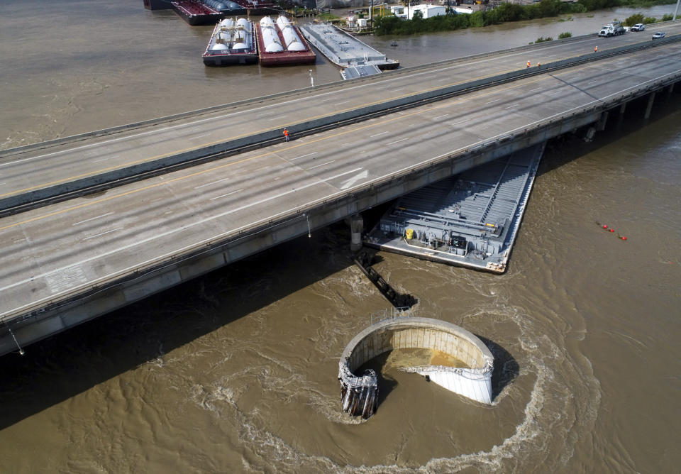 Interstate 10 at the San Jacinto River was shut down in both directions after multiple barges collided with the bridge Friday, Sept. 20, 2019, in Houston, in the aftermath of Tropical Storm Imelda. (Godofredo A. Vasquez/Houston Chronicle via AP)