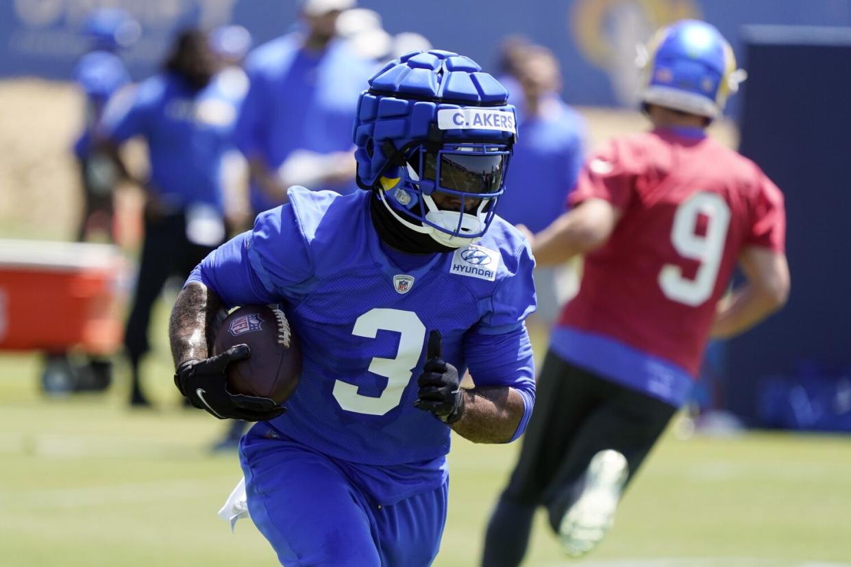 Rams running back Cam Akers runs during practice Monday.