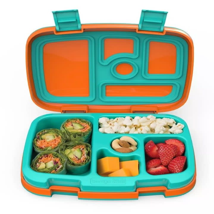Orange and teal bento box opened to reveal colorful lunch