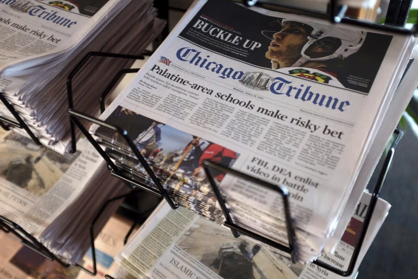 FILE - In this Monday, April 25, 2016, file photo, Chicago Tribune and other newspapers are displayed at Chicago's O'Hare International Airport. Hedge fund Alden, Tribune's largest shareholder, has offered to buy the rest of the newspaper publisher, Thursday, Dec. 31, 2020, at a price that values it at $520.6 million. (AP Photo/Kiichiro Sato, File)