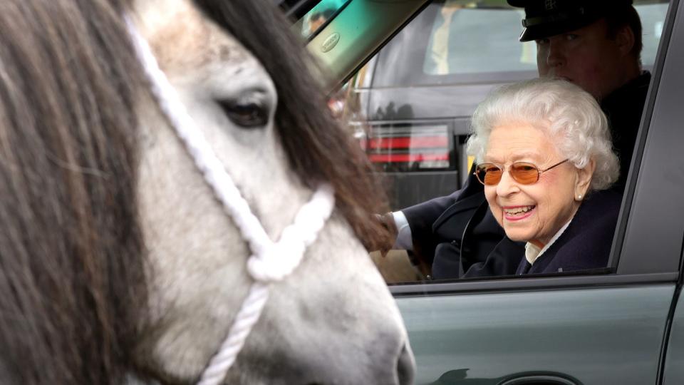 Queen Elizabeth II watches the horses from her Range Rover at The Royal Windsor Horse Show