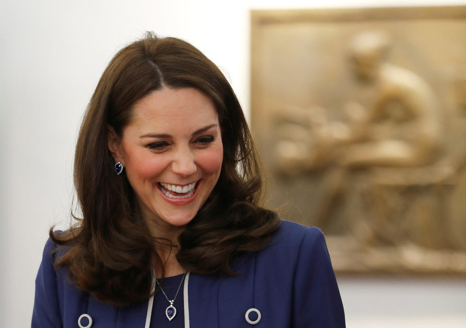 The Duchess of Cambridge showcased her growing bump on a visit to a gynecology center in London. (Photo: Getty)